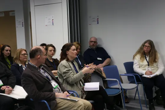 People listening to the presentation